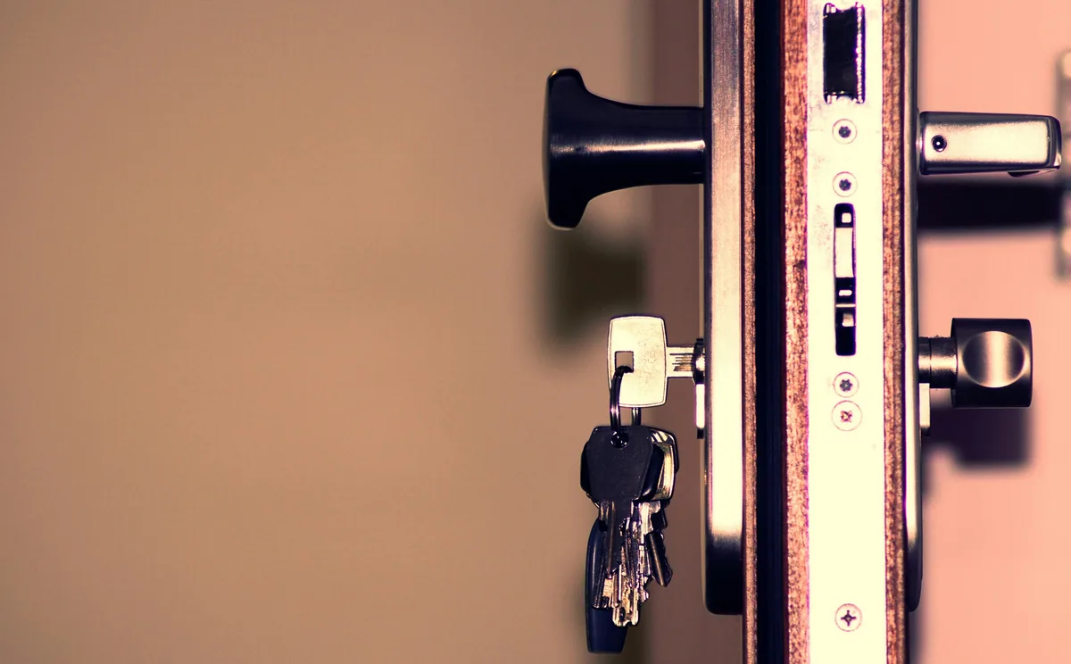 Commercial door hardware with keys still in the cylinder after a same-hour locksmith rekey