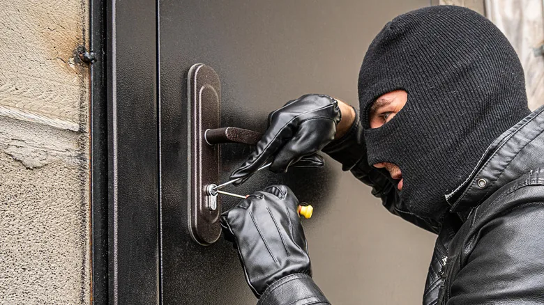 High-security lock being installed on a home door in NYC