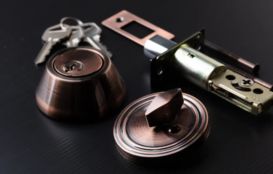 Reassembling a rekeyed deadbolt lock on a New York City door