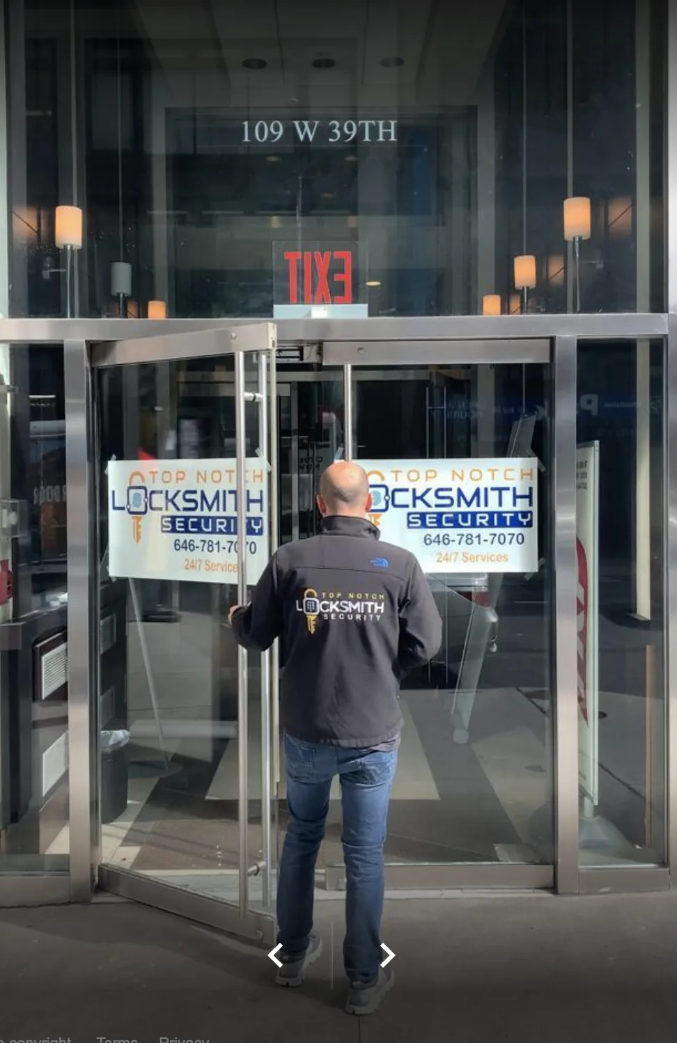 Top Notch Locksmith service van parked outside an NYC storefront