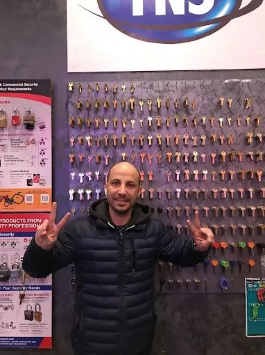 Roye, founder of Top Notch Locksmith & Security NYC, at the key wall inside the Top Notch shop