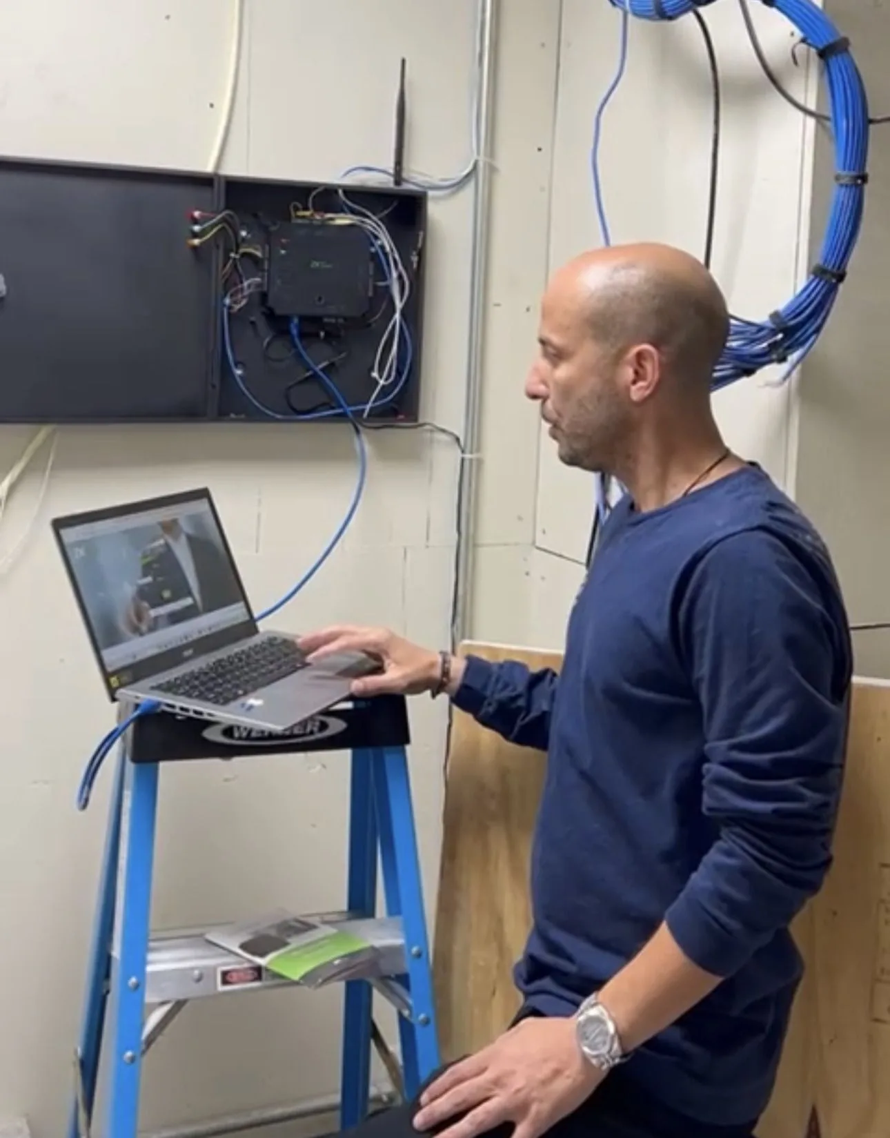 Top Notch technician wiring an access control system at an NYC building